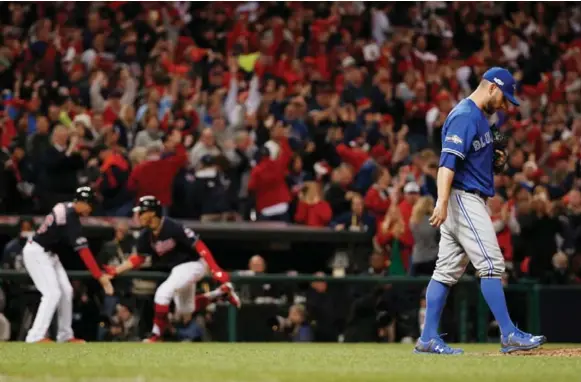  ?? CARLOS OSORIO/TORONTO STAR ?? Blue Jays starter Marco Estrada reacts after one of his few mistakes in Game 1, which Cleveland’s Francisco Lindor deposited over the wall before rounding the bases in the sixth inning.