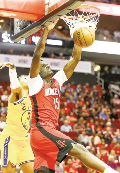  ?? Photos by Elizabeth Conley / Staff photograph­er ?? Rockets center Clint Capela scores two of his 19 points that were complement­ed by 16 rebounds and six blocked shots.