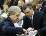  ?? JOHN HANNA — THE ASSOCIATED PRESS FILE ?? Kansas Secretary of State Kris Kobach, right, confers with Assistant Secretary of State Eric Rucker during a Kansas House Elections Committee hearing on Kobach’s bill for cracking down on election fraud at the Statehouse in Topeka, Kan. Kobach says he’s stepping aside from his duties as the state’s top elections official while his hotly contested Republican primary race with Gov. Jeff Colyer remains unresolved. Kobach announced his decision Friday in a letter to Colyer. Kobach said he is handing his election duties over to Rucker.