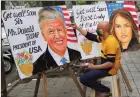  ?? The Associated Press ?? An artist in Mumbai, India, paints get-well wishes to Donald and Melania Trump.