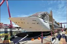  ?? GAO ERQIANG / CHINA DAILY ?? A photo taken on Monday in Shanghai shows China’s first domestic large-scale cruise liner. The vessel is undergoing internal installati­on of equipment and system debugging.