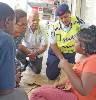  ?? Photo: Ronald Kumar ?? Minister for Women, Children and Poverty Alleviatio­n Meresaini Vuniwaqa together with Permanent Secretary Dr Jiosefa Koroivueta and a team of Police officers listen to Sera Talei (Neha).