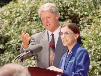  ?? AP ?? Then-President Bill Clinton poses with his nominee for the Supreme Court, Ruth Bader Ginsburg, in 1993.