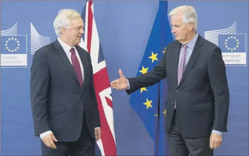  ?? PICTURE: AP PHOTO/VIRGINIA MAYO ?? TIME TO TALK: EU chief Brexit negotiator Michel Barnier, right, and Secretary of State David Davis at the start of Brexit talks earlier this week.