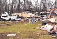 ?? BRENDAN FARRINGTON/ASSOCIATED PRESS ?? Mobile homes lie destroyed by severe weather in Cook County, Ga., on Monday. Gov. Nathan Deal declared a state of emergency in several counties, including Cook.