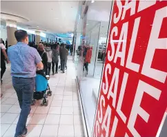  ?? GAVIN YOUNG / POSTMEDIA NEWS FILES ?? The year- end weakness in retail sales raises the possibilit­y that Canadians are doing a lot of their Christmas shopping before December sales come around.