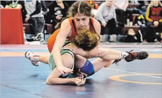  ?? ALGOMA UNIVERSITY ATHLETICS ?? Samantha Romano, top, wresting at a meet in Sault Ste. Marie.