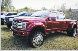  ??  ?? Winning Best of Show was Kacie Williams’ ruby red ’18 F-450. Her late-model Ford rides on a 6-inch suspension lift from Stryker Off Road Design, and 37-inch rubber mounted to 26-inch American Force wheels.
