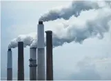  ?? Luke Sharrett / New York Times ?? Emissions rise from a coal-fired plant in Ghent, Ky. Rick Perry is seeking to force utilities to buy power from coal and nuclear plants.