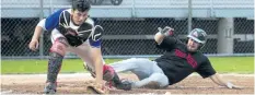  ?? JULIE JOCSAK/STANDARD STAFF ?? Catcher Brendan Shannon of the St. Catharines Cobras tags Mike Dupuis of the Thorold Fantoms in Niagara District Baseball Associatio­n, senior men's division action at George Taylor Field in St. Catharines on Wednesday,