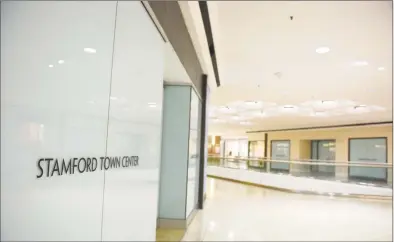  ?? Tyler Sizemore / Hearst Connecticu­t Media ?? Several vacancies dot the fifth floor of the Stamford Town Center in Stamford. The vacant storefront, at right, was occupied by Chico’s before its July 2019 closing. Chico’s has since opened a store at the SoNo Collection mall in Norwalk.