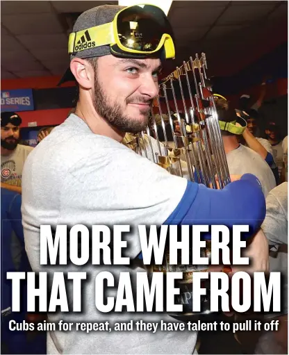  ?? | DAVID J. PHILLIP/ AP ?? It won’t be easy to pry the World Series trophy from slugger Kris Bryant and his Cubs teammates in 2017.