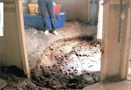  ?? PICTURE: NHLANHLA PHILLIPS ?? CALLOUS KILLING: The shallow grave where the body of 72-year-old Cecilia Ntelele was buried inside a shack in Finetown, south of Joburg.