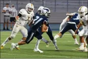  ?? MATT BATES — ENTERPRISE-RECORD ?? Pleasant Valley’s Parker Williams (21) looks to get outside against Yuba City on Sept. 3at Asgard Yard in Chico.