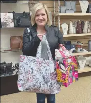  ?? Courtesy photo ?? Pictured at left is the May Shop and Dine winner Tiffany Pierson picking up her swag bag at Merle Norman. Shop and Dine for this month will be taking place this evening with a special focus on teacher appreciati­on.