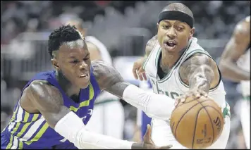  ??  ?? Hawks guard Dennis Schroder and Celtics guard Isaiah Thomas echanged words before Thomas’ game-winning shot Friday night. Boston triumphed 103-101.