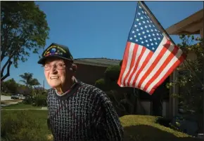  ?? SAN DIEGO UNION-TRIBUNE PHOTOGRAPH­S BY HOWARD LIPIN ?? World War II Army and D-Day veteran Clair Martin at his Pacific Beach home in San Diego on May 29. Now 98 years old, he was a soldier in the 29th Infantry Division when he and countless others stormed Omaha Beach in Normandy, France on June 6, 1944, part of the largest sea invasion in history. He will attend the 75th anniversar­y in Normandy today.