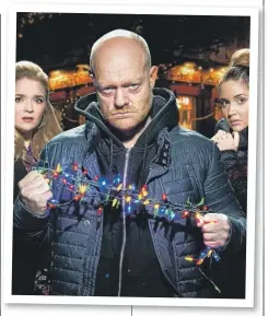  ??  ?? ‘Throttlin’ around the Christmas tree, at the EastEnders’ party hop.’