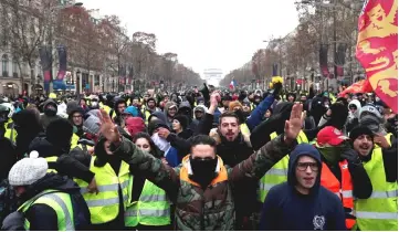  ??  ?? File photo shows protesters, wearing yellow vests, taking part in a demonstrat­ion in Paris, France. — Reuters photo