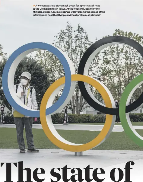  ??  ?? 1 A woman wearing a face mask poses for a photograph next to the Olympic Rings in Tokyo. At the weekend Japan’s Prime Minister, Shinzo Abe, insisted: ‘We will overcome the spread of the infection and host the Olympics without problem, as planned.’