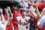  ?? ?? St. Louis Cardinals’ Nolan Gorman (16) is congratula­ted after hitting a solo home run against the Boston Red Sox during the second inning of Saturday’s game in St. Louis. (AP Photo/Joe Puetz)