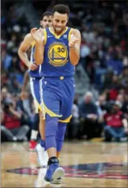  ?? GERALD HERBERT — THE ASSOCIATED PRESS ?? Golden State Warriors guard Stephen Curry (30) reacts after hitting a three-point basket in the second half of an NBA basketball game against the New Orleans Pelicans in New Orleans, Monday.