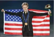  ?? GRAHAM HUGHES — THE CANADIAN PRESS VIA AP ?? Gold medalist Ilia Malinin of the U.S. strikes a triumphant pose after his record-breaking free program in Montreal.