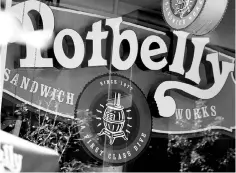  ?? — WPBloombeg photo ?? Potbelly signage is displayed in the window of a location in Washington, D.C.