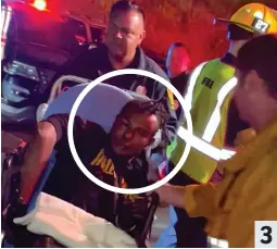  ?? ?? Suspect: Isaiah Lee is taken to an ambulance by medics 3