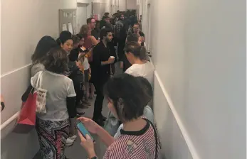  ?? HANDOUT PHOTO BY DONALD MUDAVANHU ?? A crowd of people take shelter in a staff corridor following reports of gun shots at Yorkdale Shopping Centre in Toronto on Thursday.