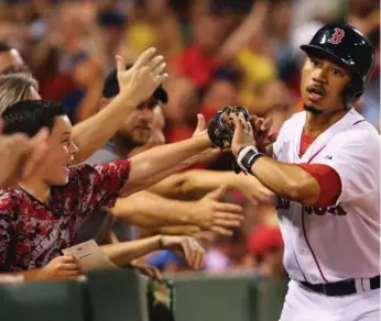  ?? MADDIE MEYER/GETTY IMAGES ?? Mookie Betts hit a solo home run in the third inning that was a double until a review by the umpires.