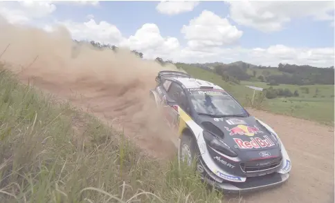  ??  ?? Ford driver Sebastien Ogier of France speeds through a corner on the second day of the World Rally Championsh­ip (WRC) Rally Australia near Coffs Harbour on Nov 17 file photo. — AFP photo