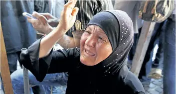  ?? BILAL HUSSEIN/AP PHOTO ?? The mother of Mustafa Ali Wehbe who was kidnapped by Islamic State group militants weeps in a tent set up in downtown Beirut, Lebanon, on Sunday.