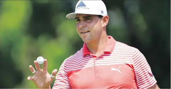  ?? STUART FRANKLIN/GETTY IMAGES ?? Gary Woodland broke the record for a 36-hole score in a PGA Championsh­ip on Friday. He’s 10 strokes under par after two rounds at Bellerive in St. Louis.