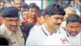  ?? RJD strongman Shahabuddi­n surrenders in court after his bail was cancelled in Siwan, Bihar, on Friday. ?? PTI PHOTO