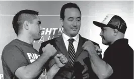  ??  ?? RICARDO "The Bully" Lamas and BJ "The Prodigy” Penn show their fighting stance before Kenneth Berger, UFC Executive Vice President and General Manager, Asia (middle). The two fighters headline the UFC Fight Night Manila at SM MOA Arena on Oct.15. With...