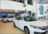  ??  ?? Inside the showroom of the newly rebuilt Rensselaer Honda on Route 7in Brunswick.