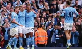  ?? Against Brighton. Photograph: Robbie Jay Barratt/AMA/Getty Images ?? Erling Haaland is congratula­ted by his Manchester City teammates after making it 1-0