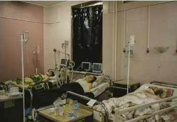  ?? FELIPE DANA/AP ?? Civilians who were injured during a Russian artillery attack are treated in a hospital Saturday in Kharkiv.