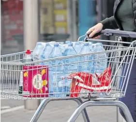  ?? PHOTO: COLIN KEEGAN/COLLINS ?? Stocking
up: Water shortages could be back to haunt people in the Greater Dublin area over Christmas.
