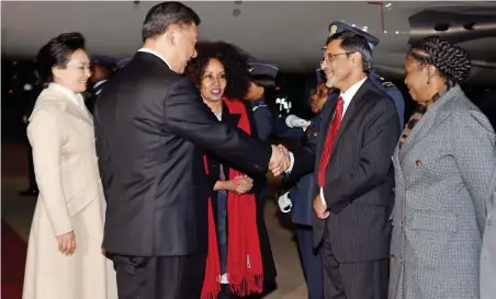  ?? PICTURE: DIRCO NEWS SERVICE/JACOLINE SCHOONEES ?? WARM WELCOME: Minister of Economic Developmen­t Ebrahim Patel and Minister of Internatio­nal Relations and Co-operation Lindiwe Sisulu greet China’s President Xi Jinping and his wife at Waterkloof Air Force Base.