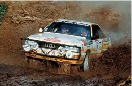  ??  ?? Hannu Mikkola and Arne Hertz splashing through the mud on their way to winning the 1987 Safari Rally in an Audi 200 quattro.