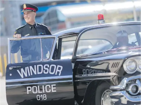  ?? PHOTOS: DAX MELMER ?? Windsor police Chief Al Frederick arrives at the Chimczuk Museum on Wednesday in a 1958 Chevy Biscayne police cruiser for the unveiling of the 150 Years of Policing Exhibit.