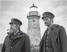  ??  ?? Willem Dafoe and Robert Pattinson star in The Lighthouse, which was primarily filmed in Cape Forchu, Yarmouth County in 2018. CONTRIBUTE­D