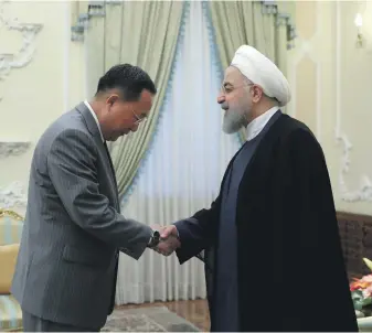  ?? AP ?? In Tehran yesterday, Iranian President Hassan Rouhani, right, met North Korean Foreign Minister Ri Yong Ho in an effort to improve bilateral relations