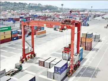  ?? HENG CHIVOAN ?? The value of imports and exports passing through the Sihanoukvi­lle Special Economic Zone (SSEZ) was about $710 million in the first quarter – $437 million in the first two months alone.