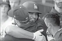 ?? Gary Coronado Los Angeles Times ?? ALBERT PUJOLS is congratula­ted by teammates after his home run tied Babe Ruth for fourth all time for extra-base hits.