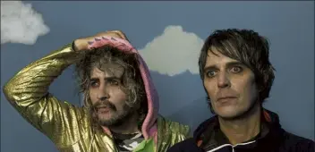  ?? Courtesy Warner Bros. ?? Wayne Coyne, left, and steven drozd of the flaming Lips and the rest of the band played two shows over the weekend in which they and the audience were in ‘space bubbles.’