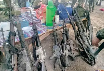  ?? CONTRIBUTE­D PHOTO ?? Photo released by the 6th Infantry Division shows the weapons recovered by the military following deadly clashes in Maguindana­o del Sur on Tuesday, April 23, 2024.