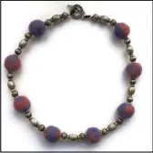  ??  ?? Diane Redden recently began using alpaca fibre to create beads she uses in necklaces.